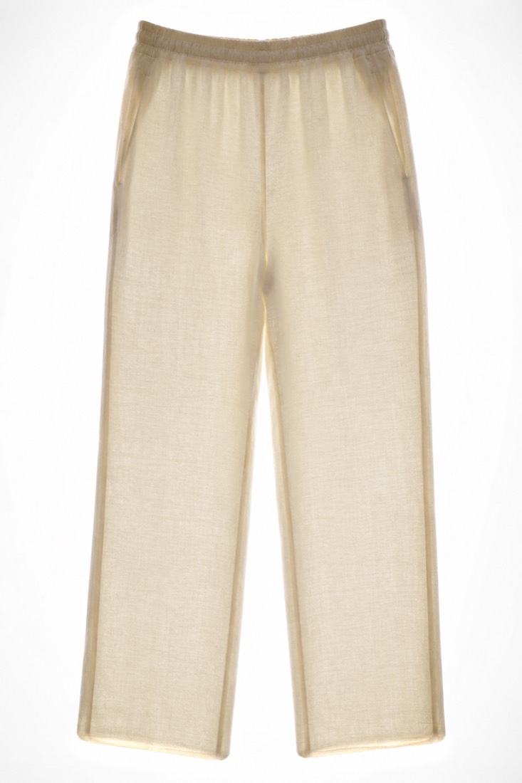 Cropped Trouser photographed against a backlight so the opacity of the cloth is visible.