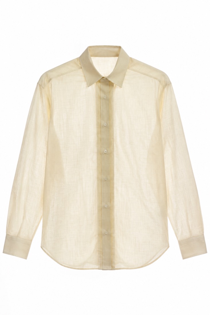The same shirt held against a lightbox: the double-layer front placket blocks the light while the body panels stay opaque.
