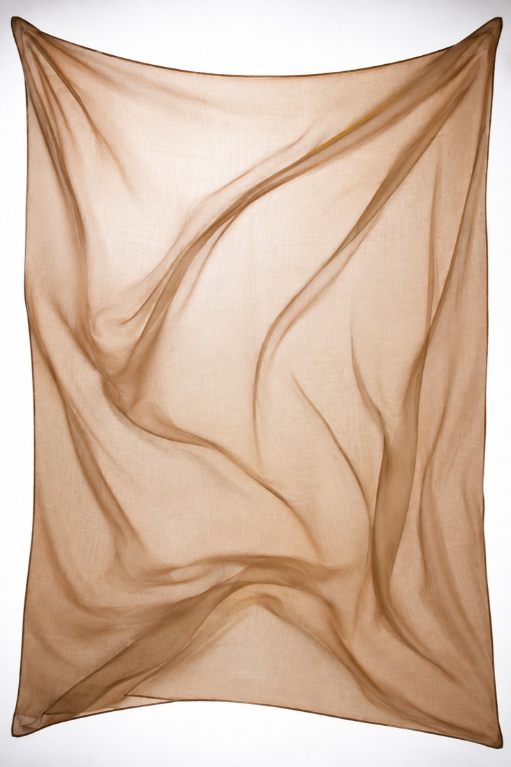 Scarf Silk-Blend Square photographed against a backlight so the opacity of the cloth is visible.